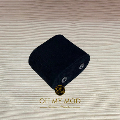 MOD watch on a modern desk next to a laptop